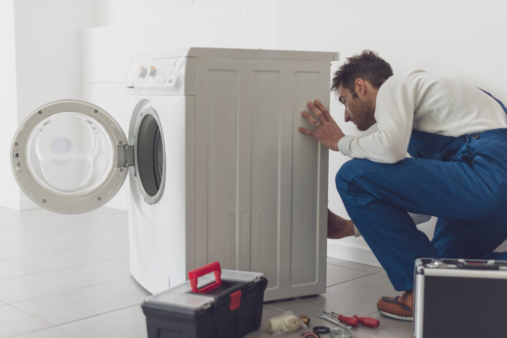 AdobeStock_431426550-washing-machine-repair-1024×683 رفع مشکل ورود آب به درون مخزن ماشین لباسشویی-09121507825